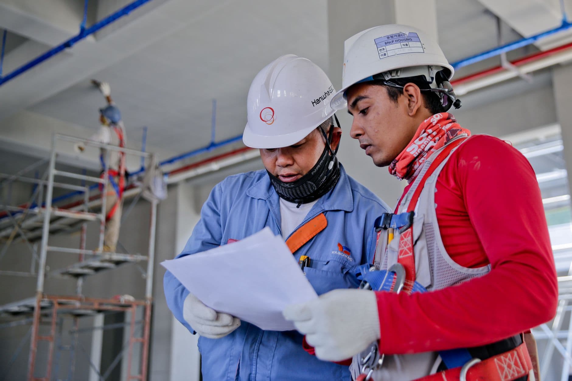 engineer reading phone worksite