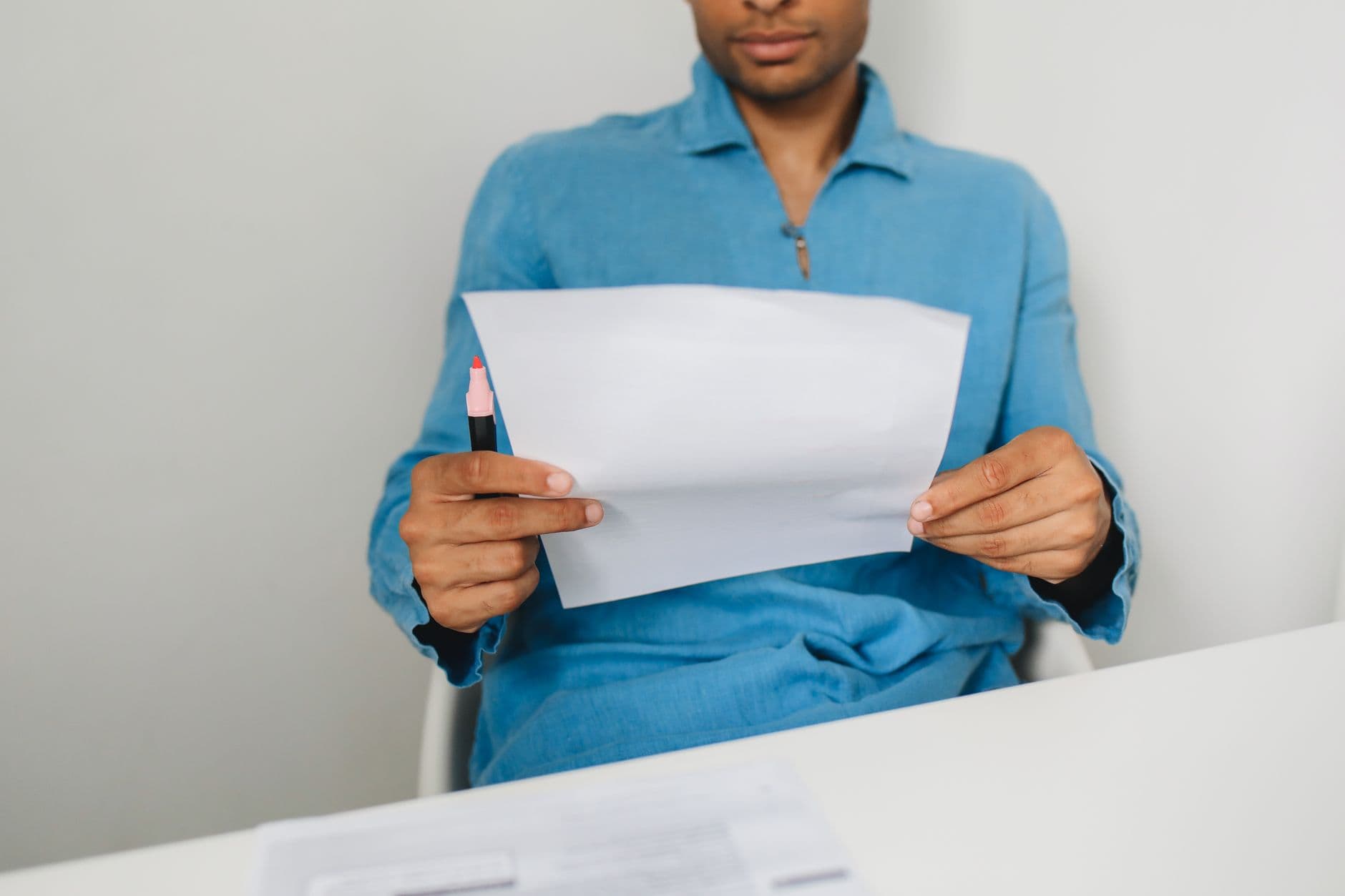 office worker reading letter desk