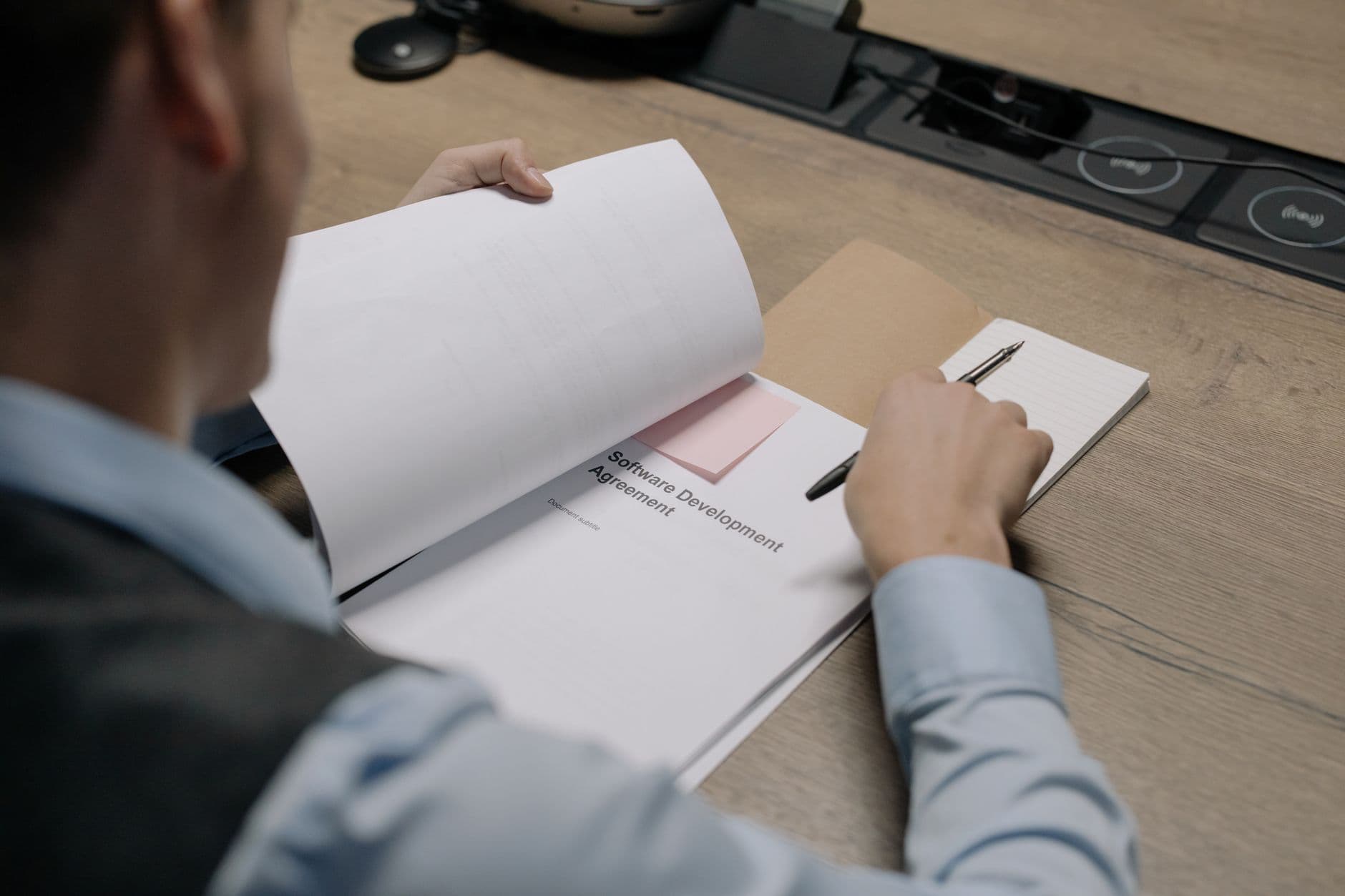 office worker reviewing paperwork desk